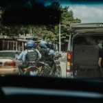 man in black helmet riding motorcycle during daytime