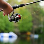 person holding fishing reel