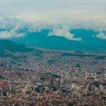 village houses and city buildings under white clouds during daytime