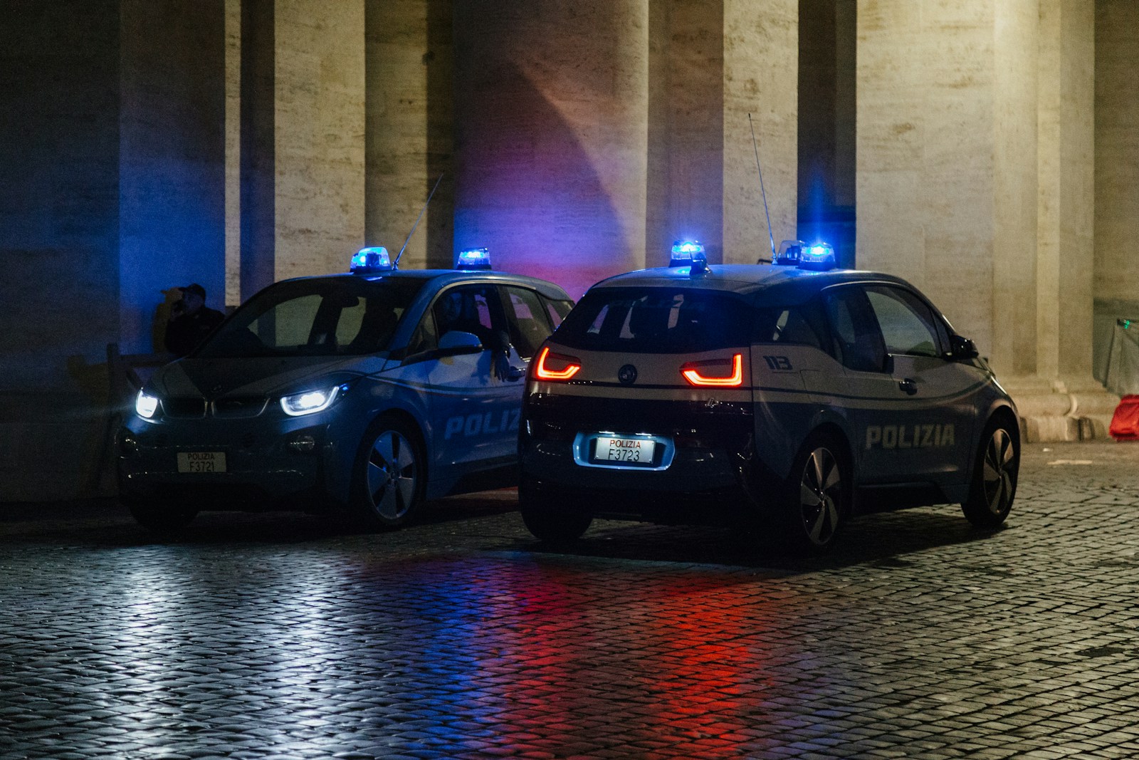 a couple of police cars parked next to each other