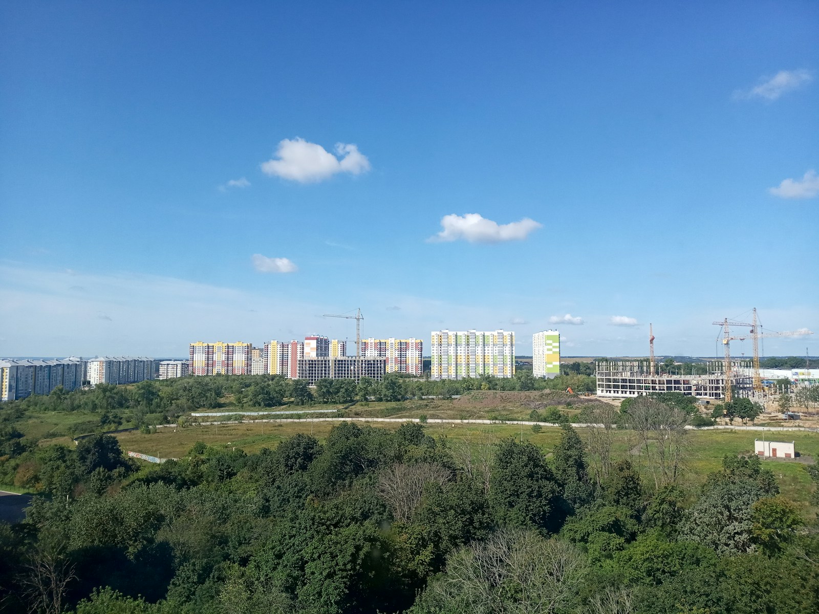 a view of a city from a hill