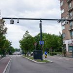 a street with a traffic light on the side of it