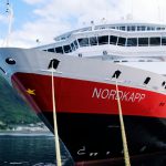 white and red ship on sea during daytime