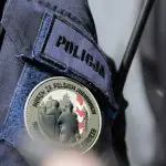 a police officer with a badge on his uniform