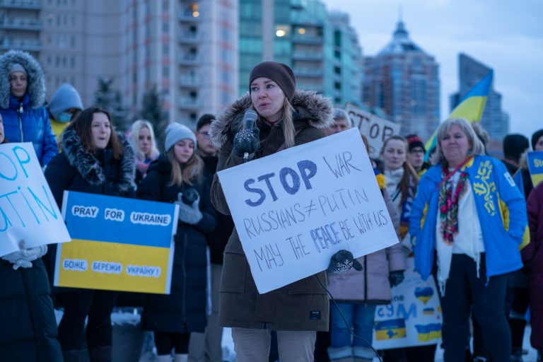 a group of people holding signs in the street