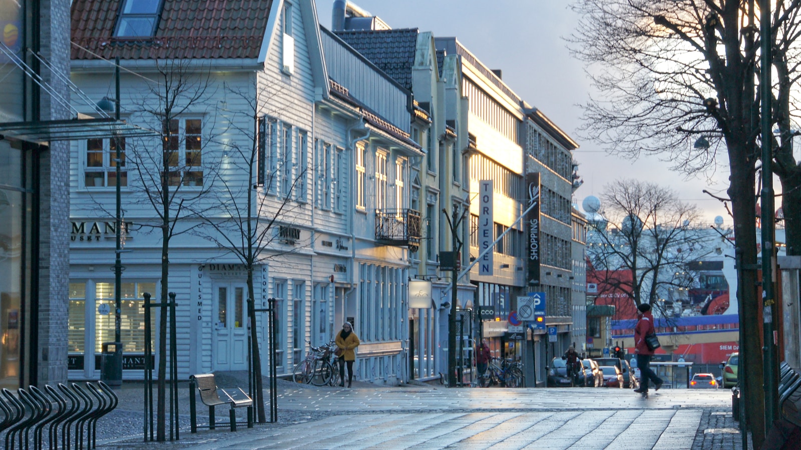 people walking on sidewalk near buildings during daytime