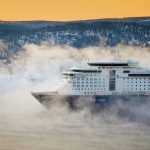 white and bleu cruise ship near mountain at daytime