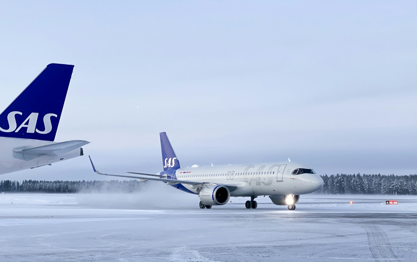 a large jetliner sitting on top of an airport tarmac