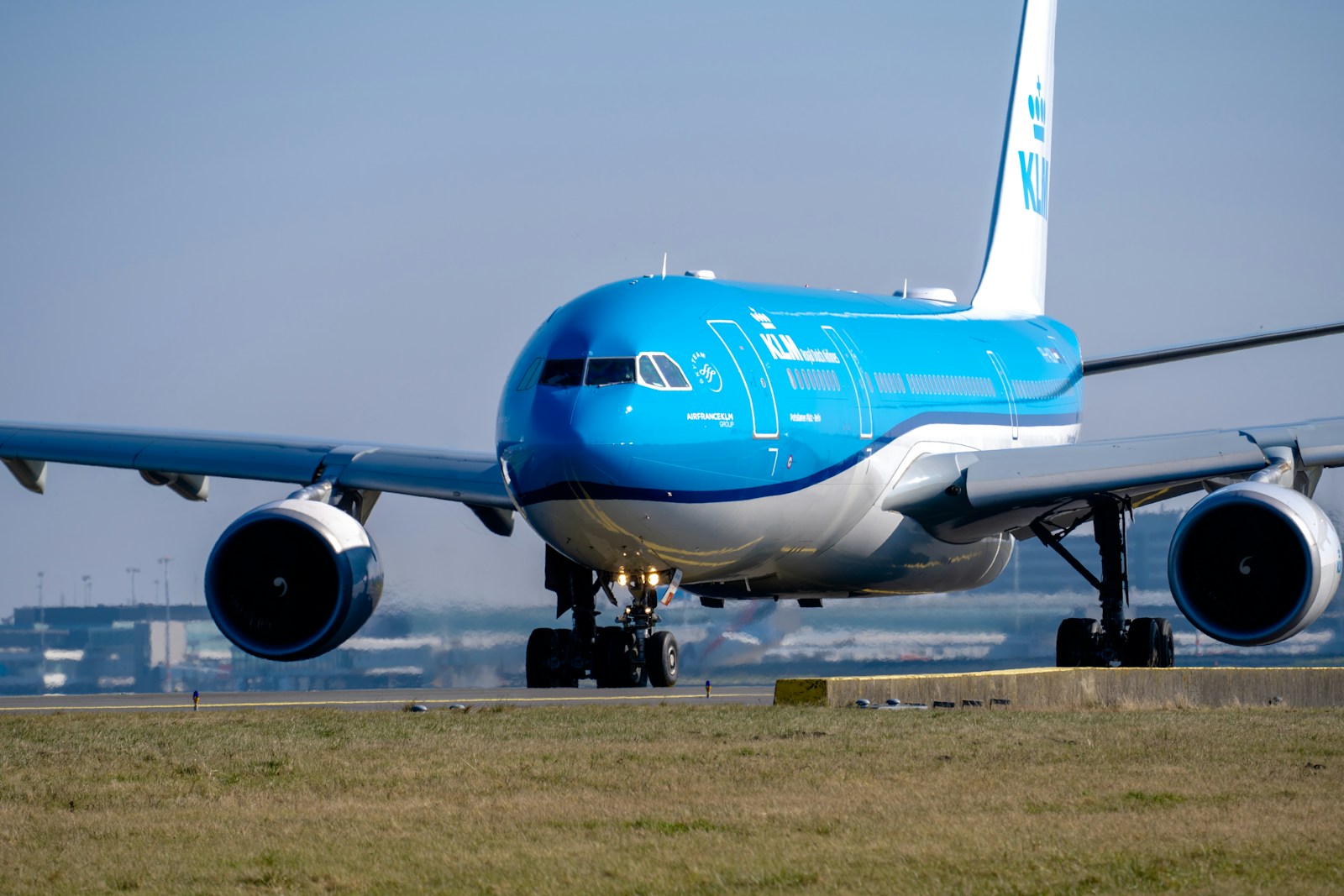 a large jetliner sitting on top of an airport runway