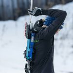 a man holding a ski pole in the snow