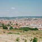 a view of a city from the top of a hill