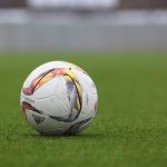 white and gray Adidas soccerball on lawn grass