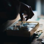 a close up of a person playing a board game