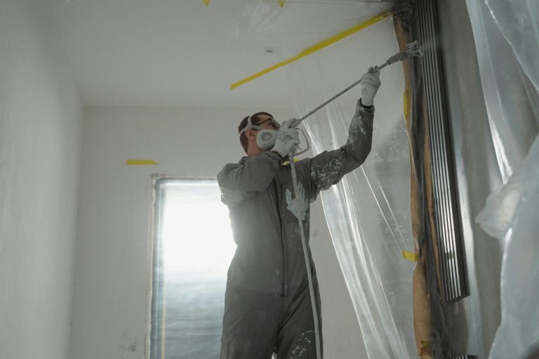 Man in Black Jacket Holding Black Rope