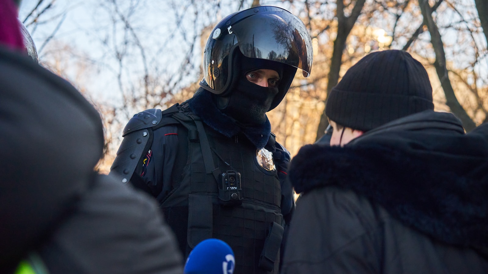 man in black jacket wearing helmet