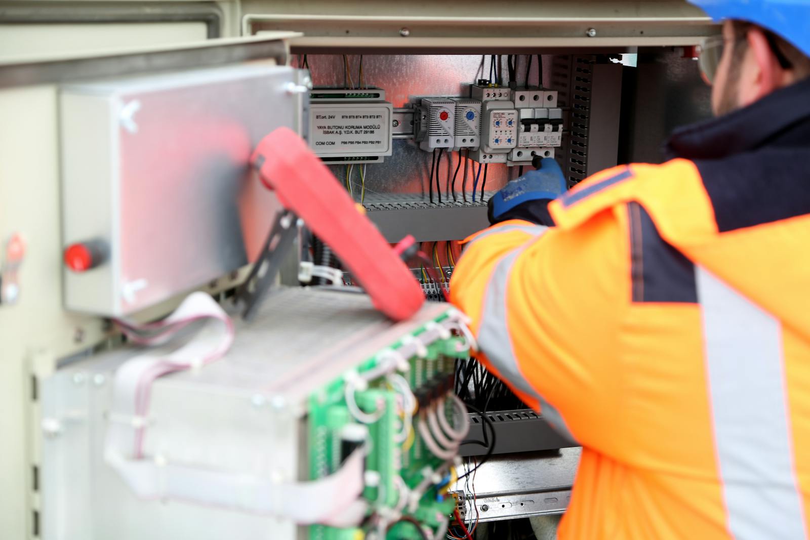 A Man Maintaining an Inverter